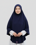Woman wearing a navy hijab and white shirt on a light gray background